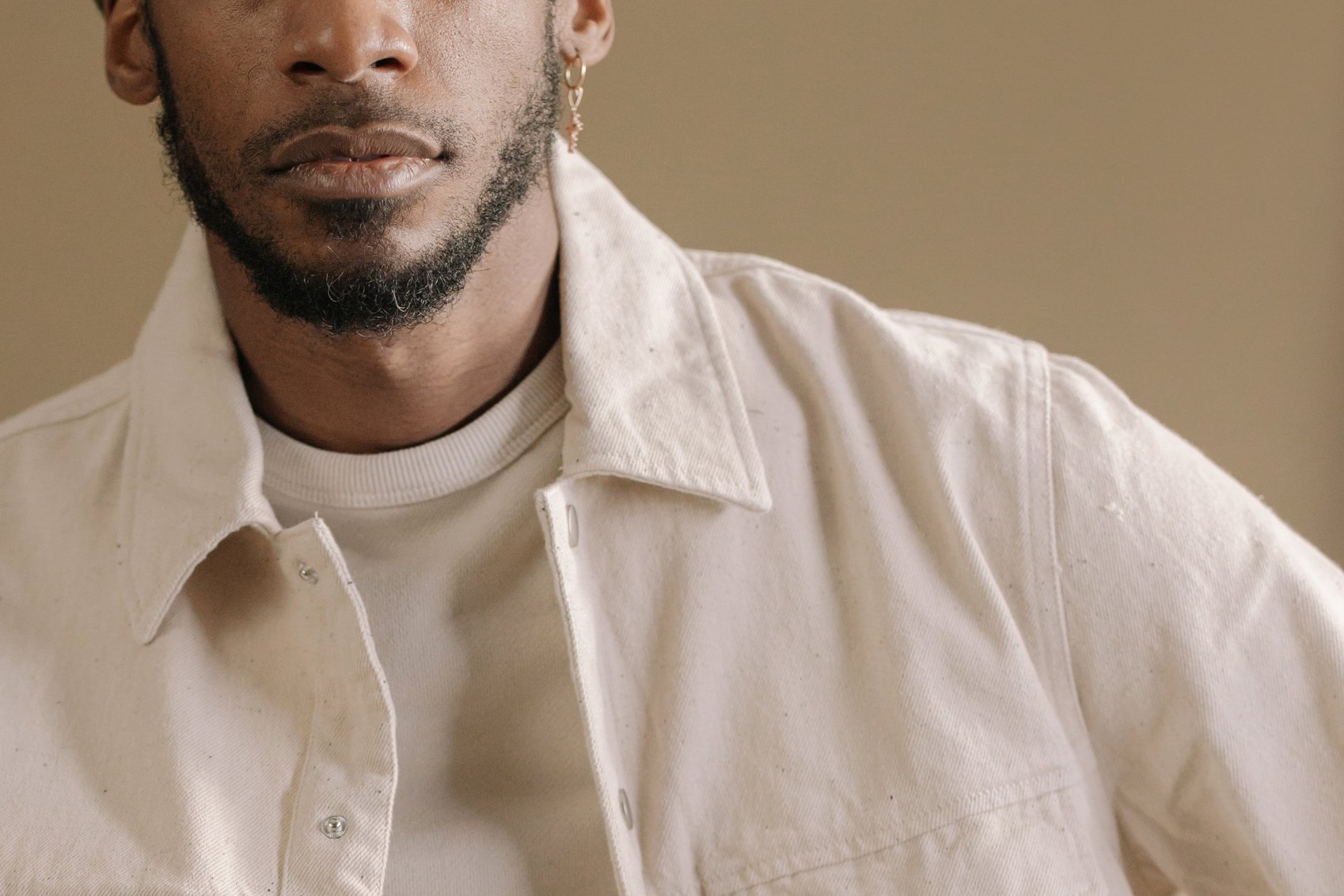 Bearded Man Wearing a White Jacket